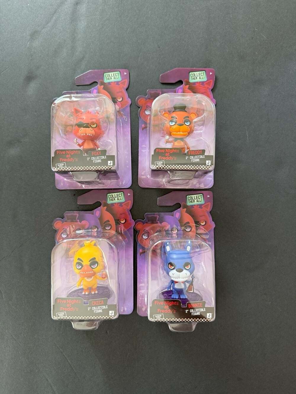 Set of 4 Jazwares Five Nights at Freddy's 2" Collectible Glowing Eyes Figure